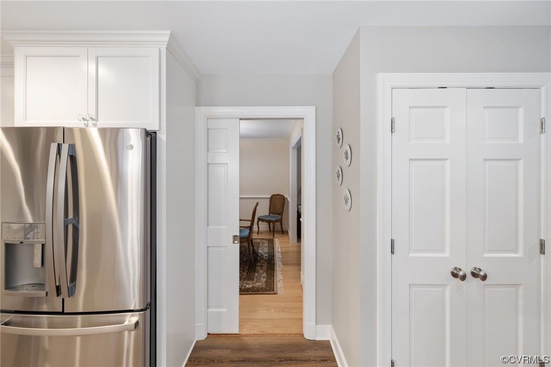 2730 West Brigstock Road Midlothian, VA 23113 - Photo 20 of 49 a view of a refrigerator in kitchen and entryway