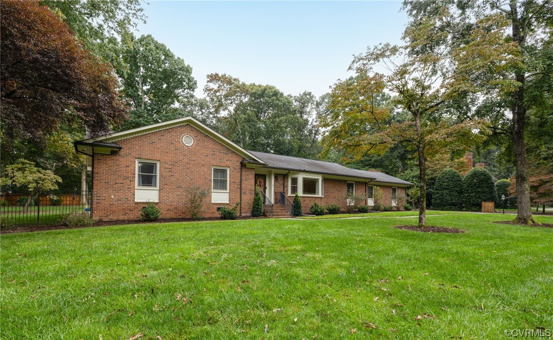 2730 West Brigstock Road Midlothian, VA 23113 - Photo 32 of 49 a house that is sitting in the grass