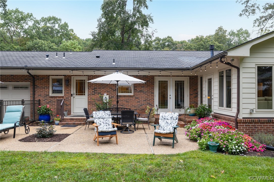2730 West Brigstock Road Midlothian, VA 23113 - Photo 35 of 49 a view of a house with backyard and sitting area