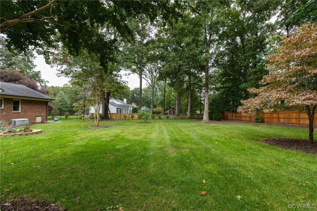 2730 West Brigstock Road Midlothian, VA 23113 - Photo 39 of 49 a view of a house with backyard and a tree