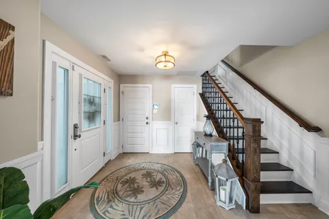 a view of entryway with wooden floor