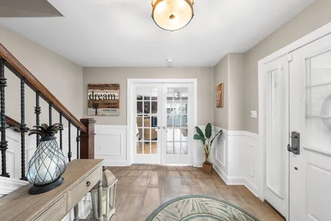 a view of entryway with wooden floor