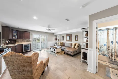 a living room with furniture wooden floor and a fireplace