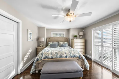 a bedroom with a large bed and a window