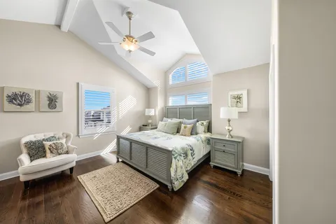 a living room with a bed furniture and a window