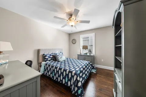 a bedroom with a bed and a table in it