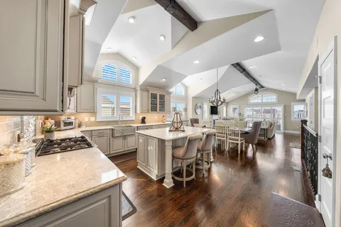 a kitchen with lots of counter top space and stainless steel appliances