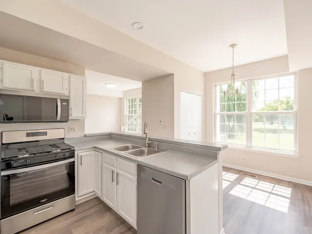 a kitchen that has a stove and a sink
