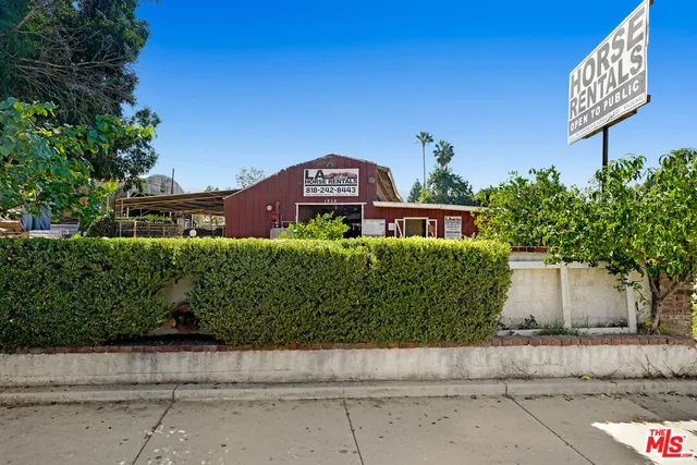 a view of street with parked cars