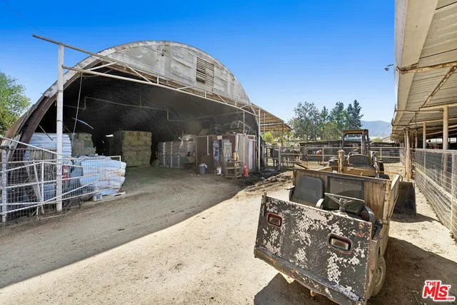a view of a two chair and table in the backyard
