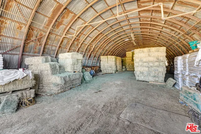 a view of a patio with swimming pool and furniture