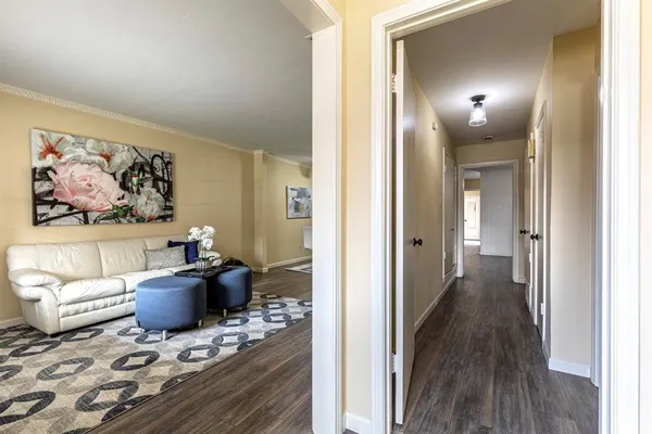 a view of a livingroom with furniture and wooden floor