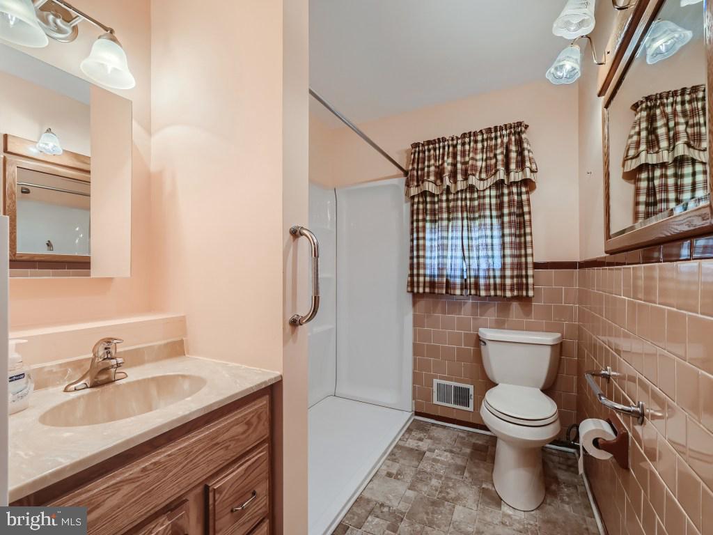 2401 East Sparrows Point Sparrows Point, MD 21219 - Photo 17 of 34 Convenient Master Bathroom on main level.