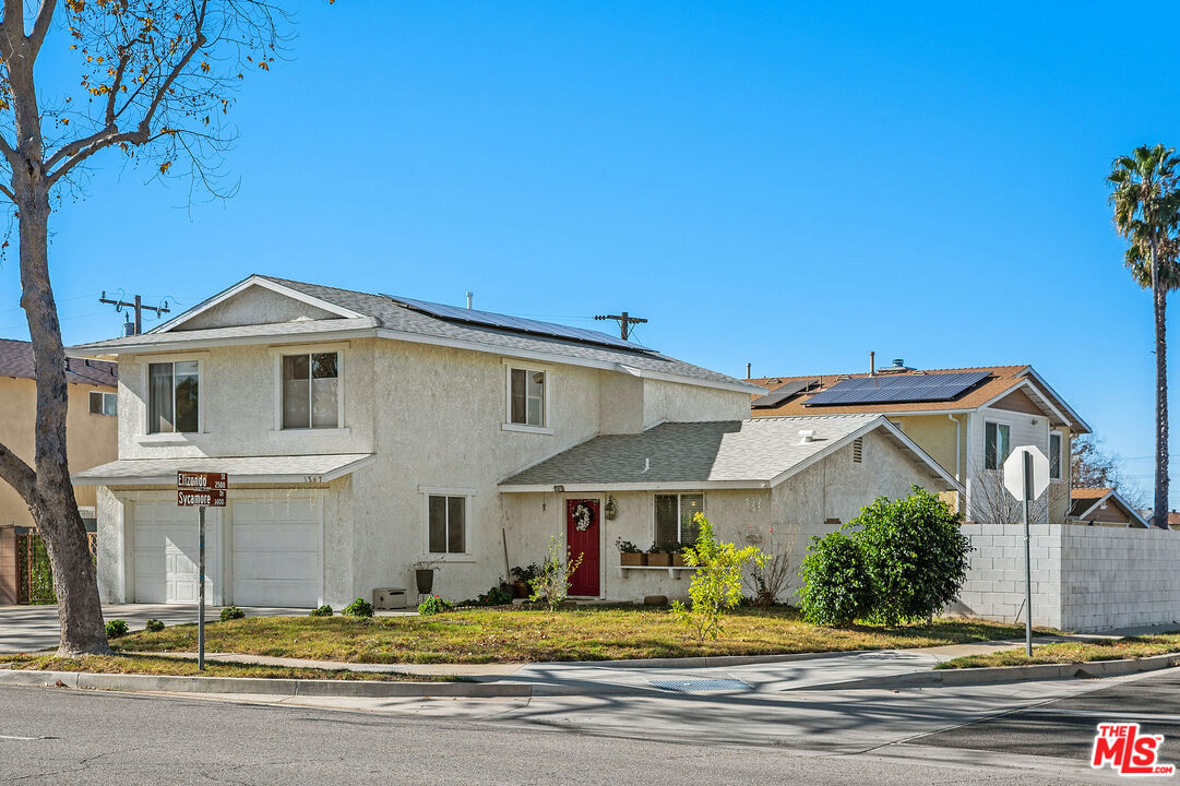 a view of a house with a yard
