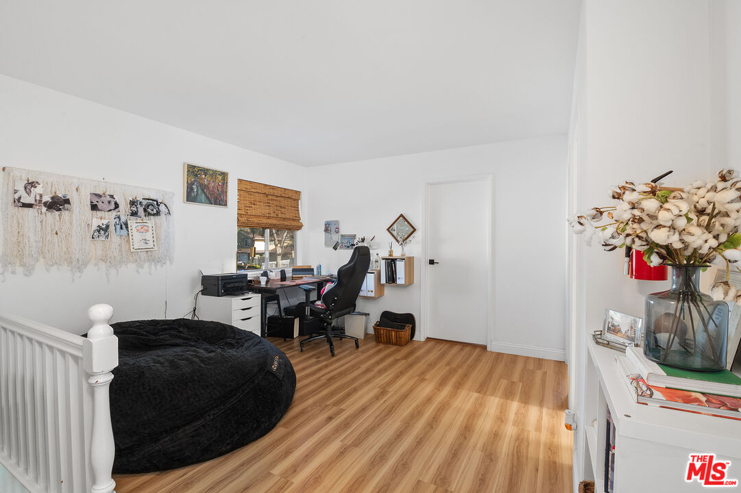 1397 Sycamore Drive Simi Valley, CA 93065 - Photo 12 of 20 a living room with furniture and flowers