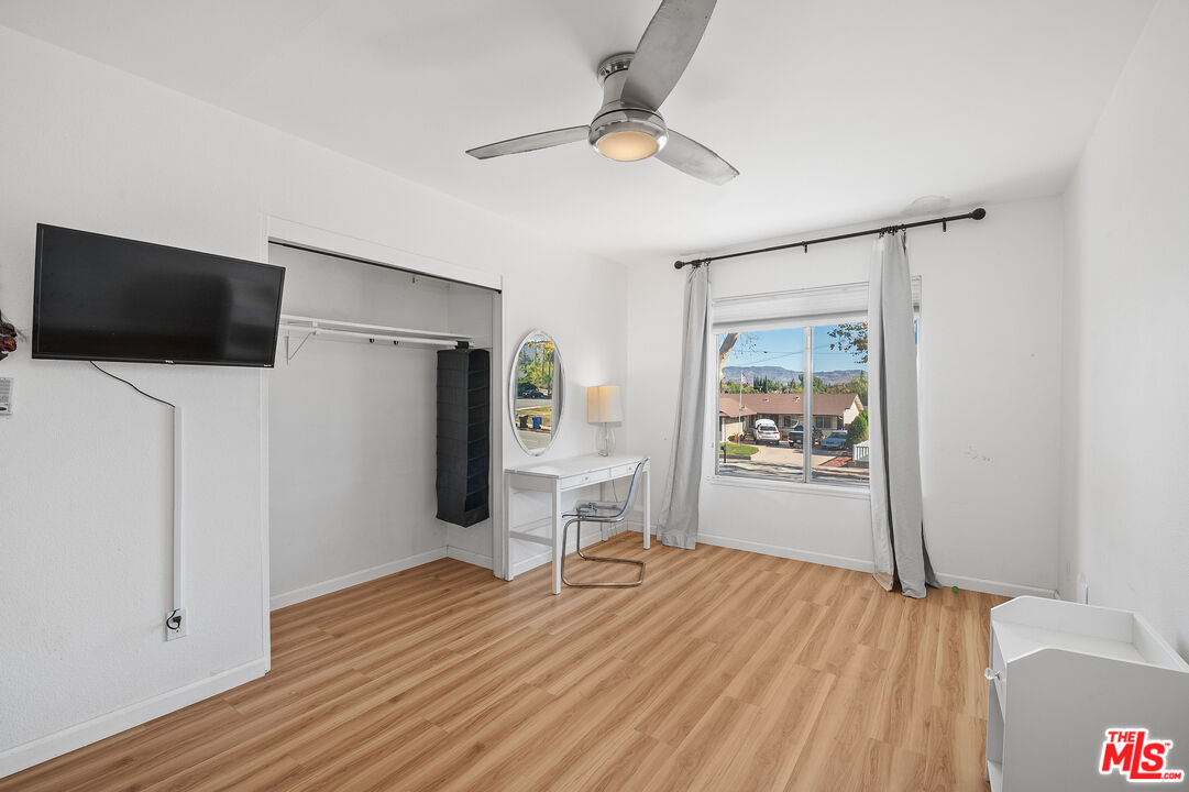 1397 Sycamore Drive Simi Valley, CA 93065 - Photo 15 of 20 a living room with furniture and a flat screen tv