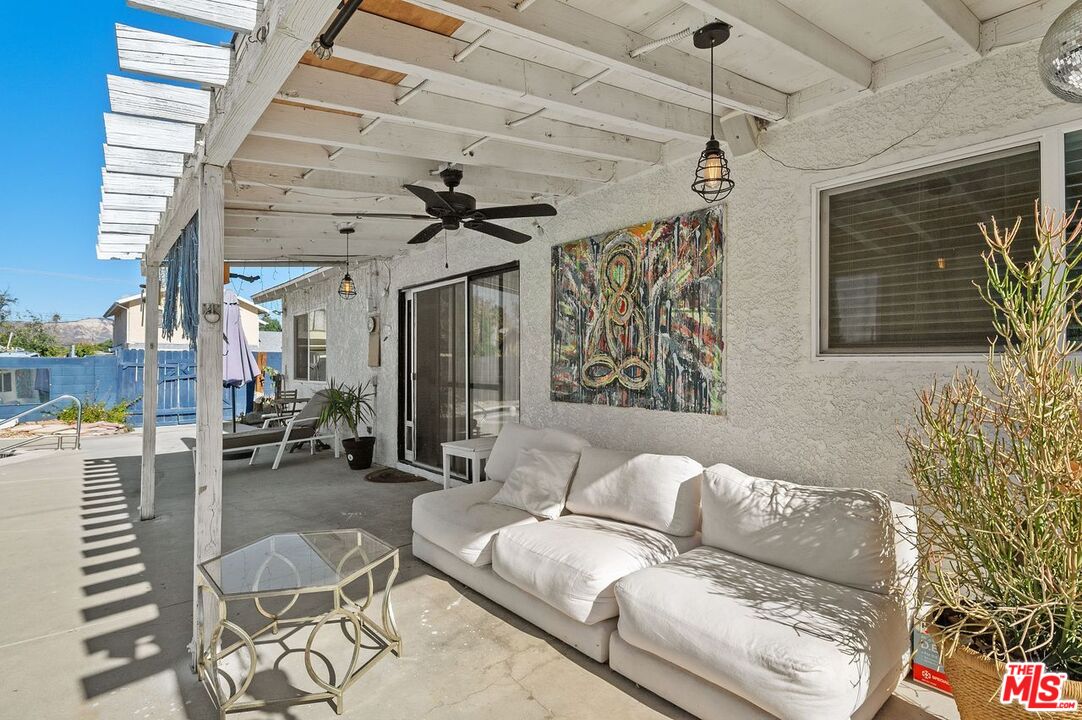 1397 Sycamore Drive Simi Valley, CA 93065 - Photo 19 of 20 a living room with furniture and a window