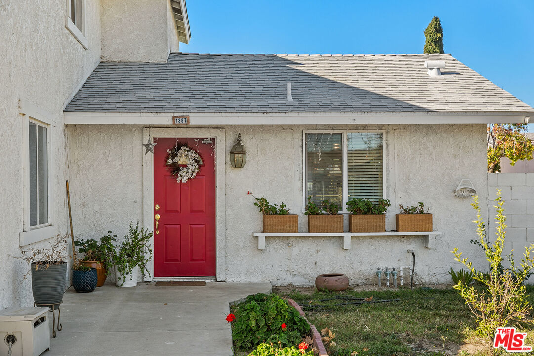 1397 Sycamore Drive Simi Valley, CA 93065 - Photo 2 of 20 a view of a house with potted plants