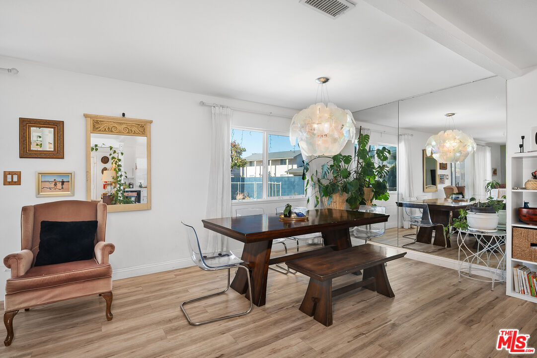 1397 Sycamore Drive Simi Valley, CA 93065 - Photo 4 of 20 a living room with furniture and a chandelier