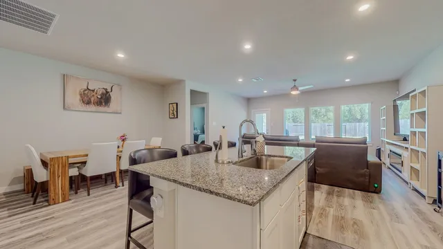 a view of a kitchen counter space and wooden floor