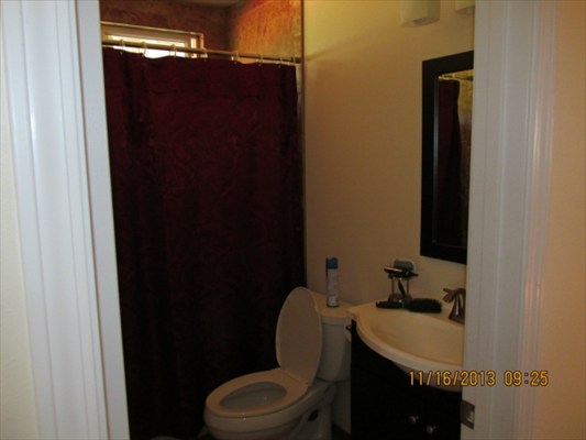 18-7892 Kini Road Mountain View, HI 96771 - Photo 11 of 22 a bathroom with a sink and a toilet