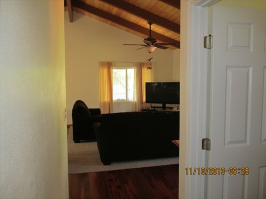 18-7892 Kini Road Mountain View, HI 96771 - Photo 12 of 22 a living room with furniture and a flat screen tv