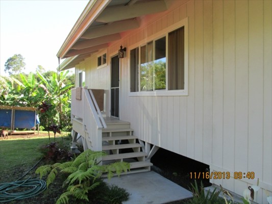 18-7892 Kini Road Mountain View, HI 96771 - Photo 20 of 22 a front view of a house with a yard