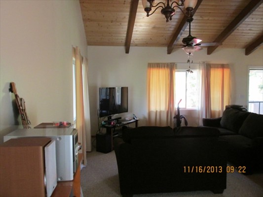 18-7892 Kini Road Mountain View, HI 96771 - Photo 7 of 22 a living room with furniture a flat screen tv and a window