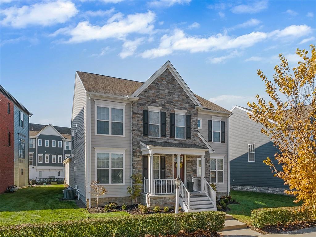 front view of a house with a yard