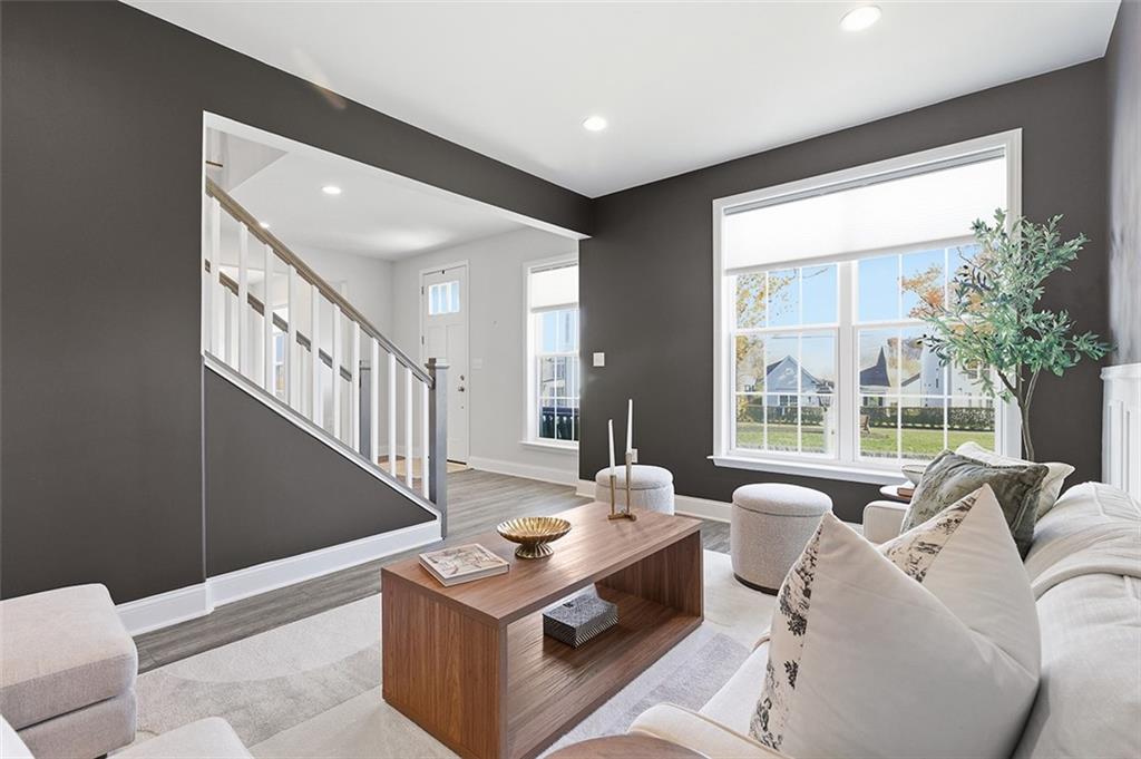 3061 Preston Way Bridgeville, PA 15017 - Photo 12 of 45 a living room with furniture a large window and a chandelier