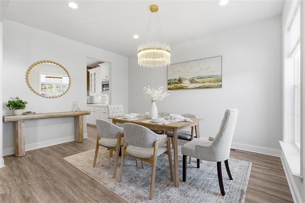 3061 Preston Way Bridgeville, PA 15017 - Photo 15 of 45 a view of a dining room with furniture and wooden floor