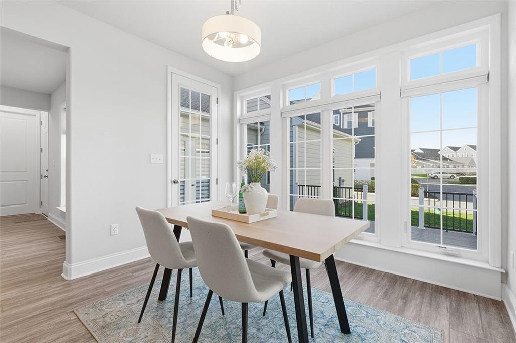 3061 Preston Way Bridgeville, PA 15017 - Photo 24 of 45 a view of a dining room with furniture wooden floor and a chandelier