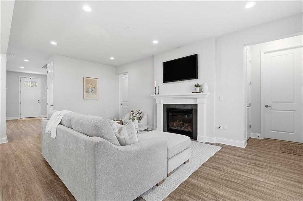 3061 Preston Way Bridgeville, PA 15017 - Photo 25 of 45 a living room with furniture a fireplace and a flat screen tv