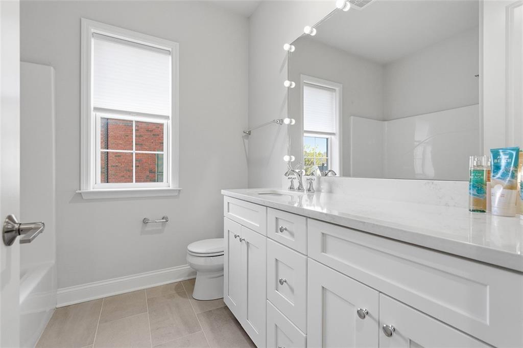 3061 Preston Way Bridgeville, PA 15017 - Photo 31 of 45 a bathroom with a sink a toilet and a window