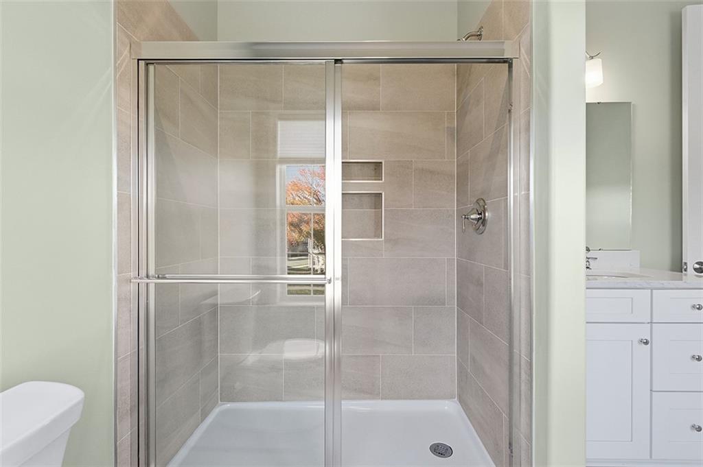 3061 Preston Way Bridgeville, PA 15017 - Photo 35 of 45 a bathroom with a glass shower door