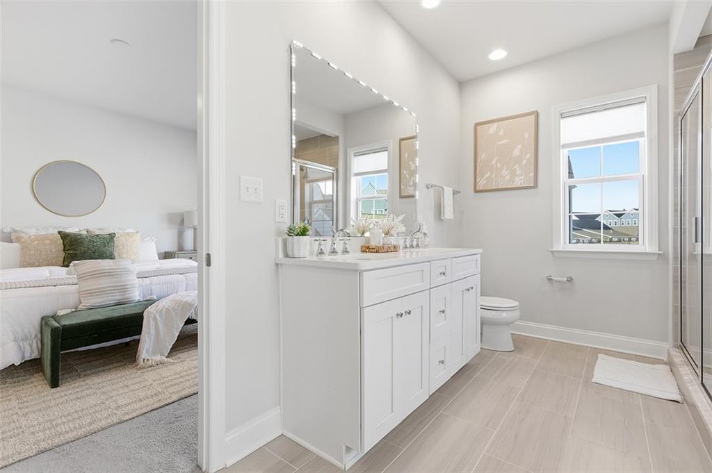 3061 Preston Way Bridgeville, PA 15017 - Photo 36 of 45 a bathroom with a double vanity sink a toilet and a mirror