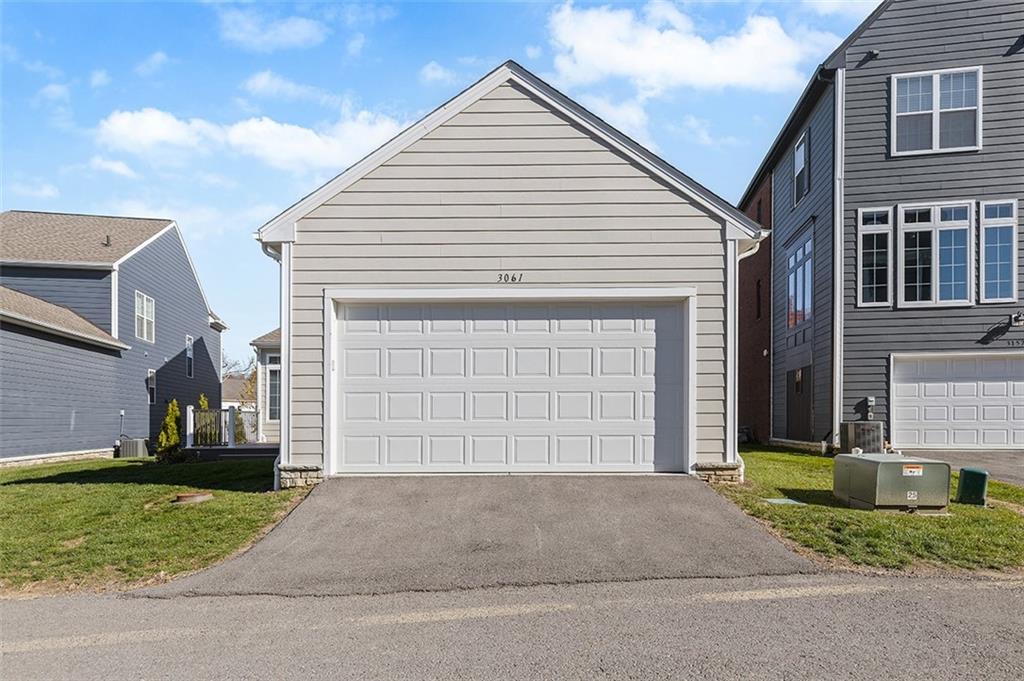 3061 Preston Way Bridgeville, PA 15017 - Photo 5 of 45 a front view of a house with a yard and garage