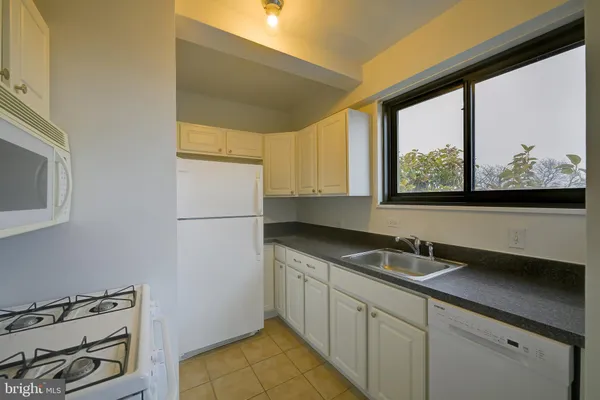 a kitchen with a stove and a microwave