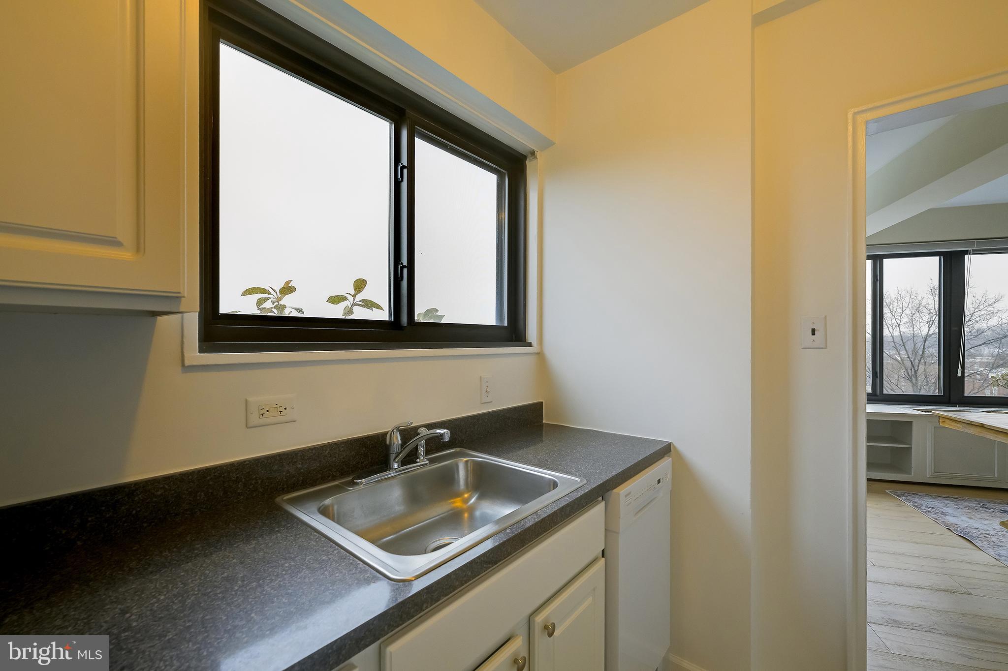 3601 Wisconsin Avenue Northwest, Unit 504 Washington, DC 20016 - Photo 15 of 23 a bathroom with a sink and a mirror