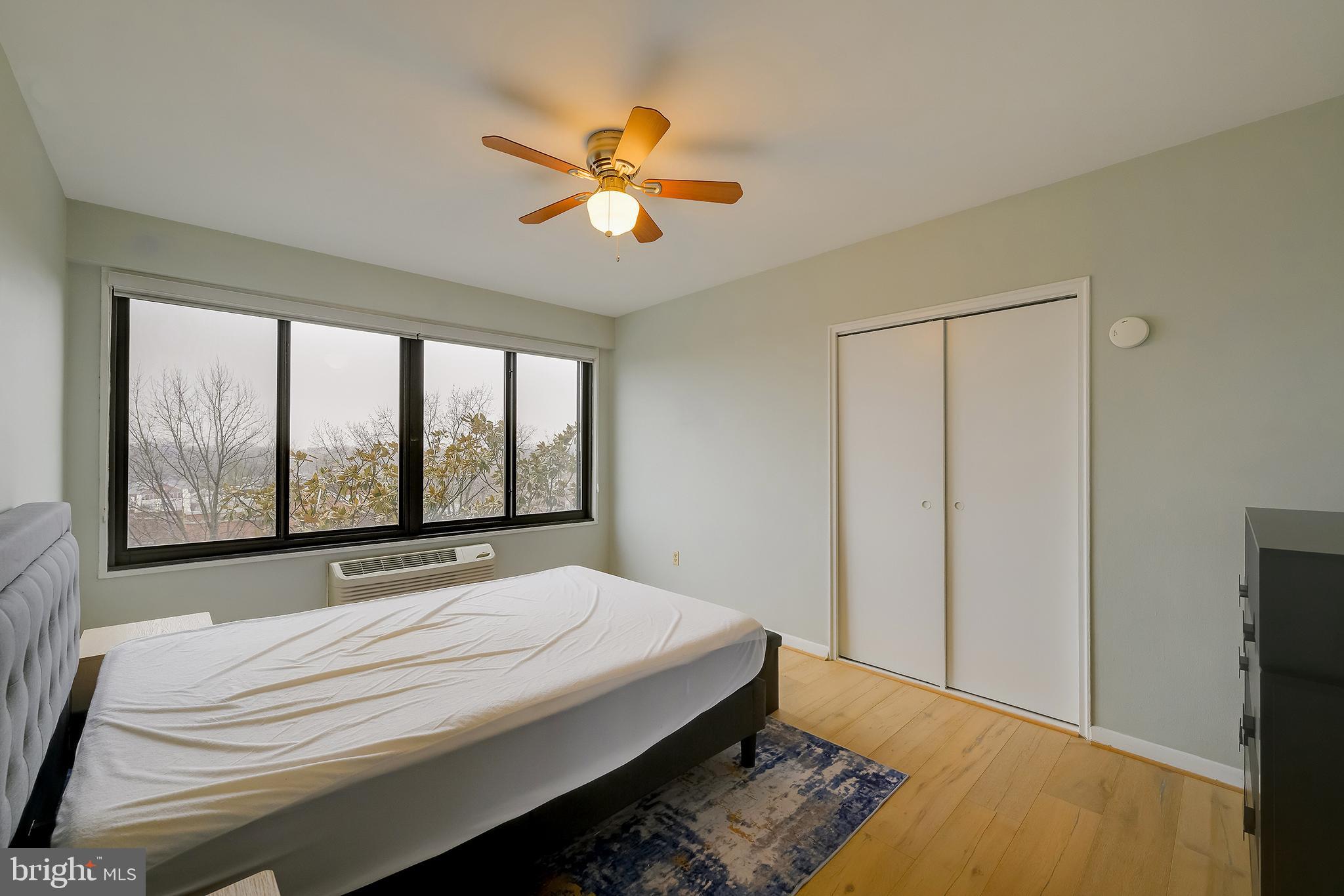 3601 Wisconsin Avenue Northwest, Unit 504 Washington, DC 20016 - Photo 20 of 23 a bedroom with a bed and a window