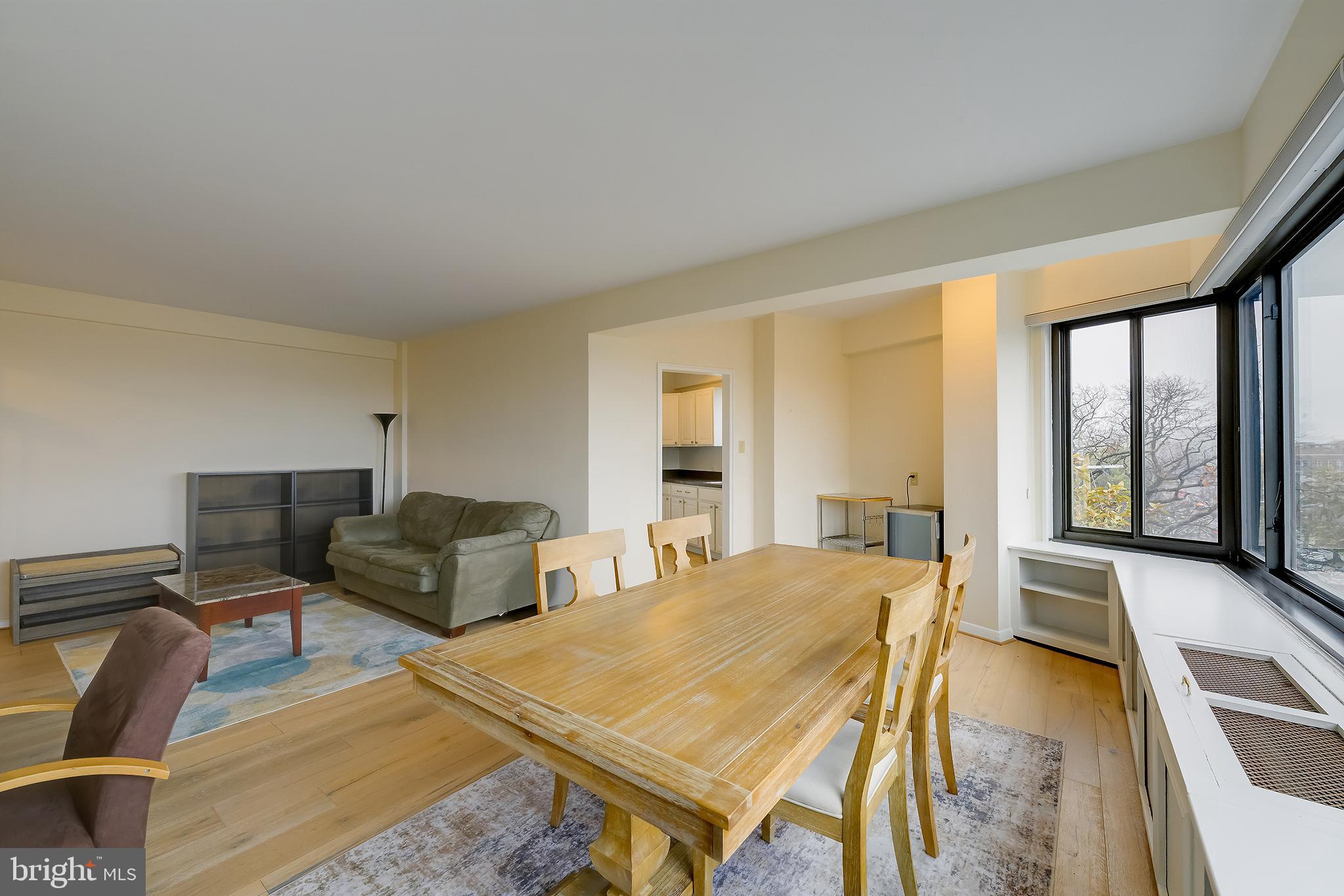 3601 Wisconsin Avenue Northwest, Unit 504 Washington, DC 20016 - Photo 6 of 23 a spacious bedroom with a bed and large windows