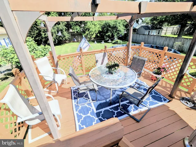 a living room with furniture a bookshelf and a fireplace