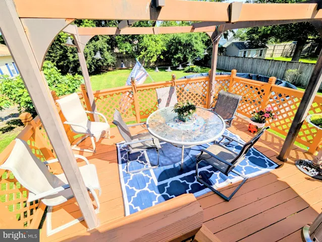 a living room with fireplace furniture and a flat screen tv