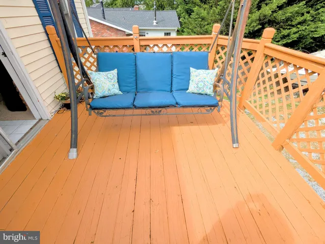 a living room with furniture a bookshelf and a fireplace