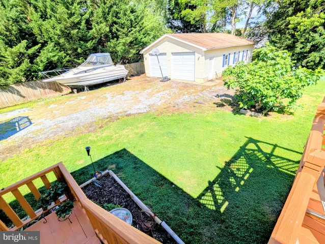 a living room with furniture a fireplace and a table