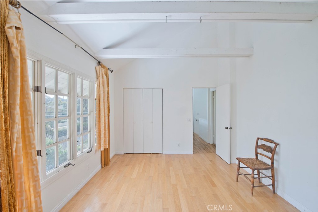 507 West Rustic Road Santa Monica, CA 90402 - Photo 14 of 19 a view of a room with wooden floor and windows