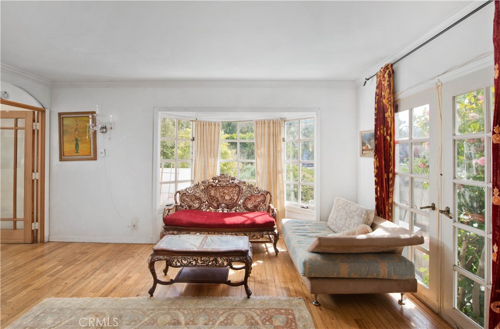 507 West Rustic Road Santa Monica, CA 90402 - Photo 8 of 19 a living room with furniture and a large window
