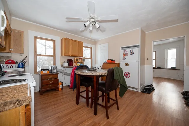 a view of a dining room with furniture window and wooden floor