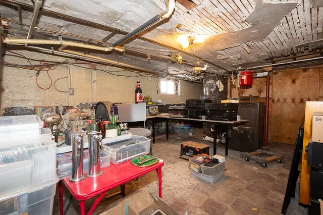 a storage room with lots of wooden furniture