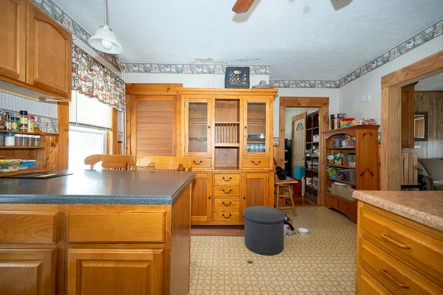 a kitchen with a refrigerator and sink